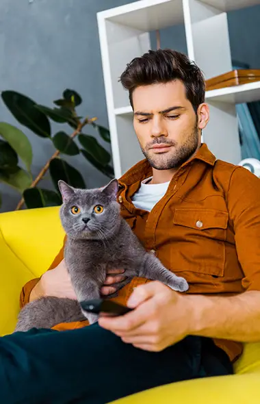 man sitting with a cat